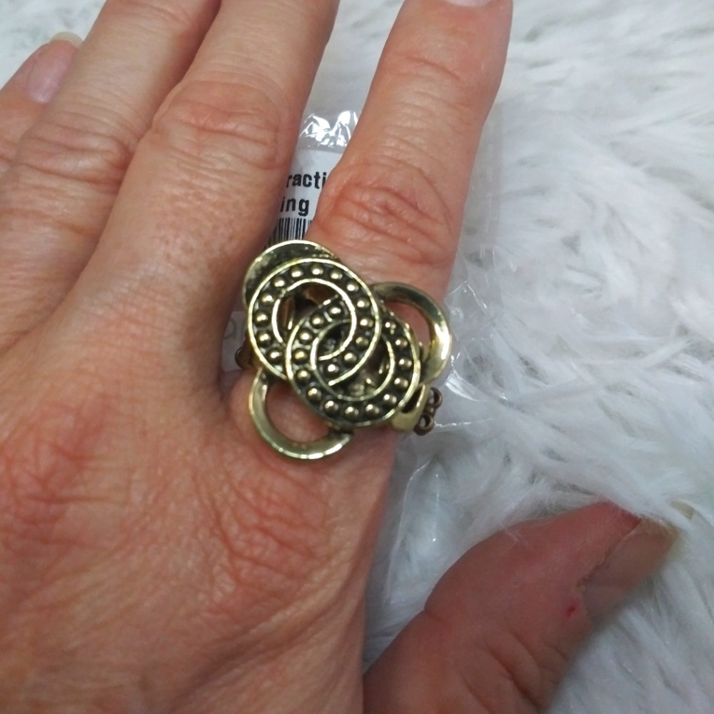 FREE WITH PURCHASE NWT Dizzying Distraction brass ring. Narrow stretchy back